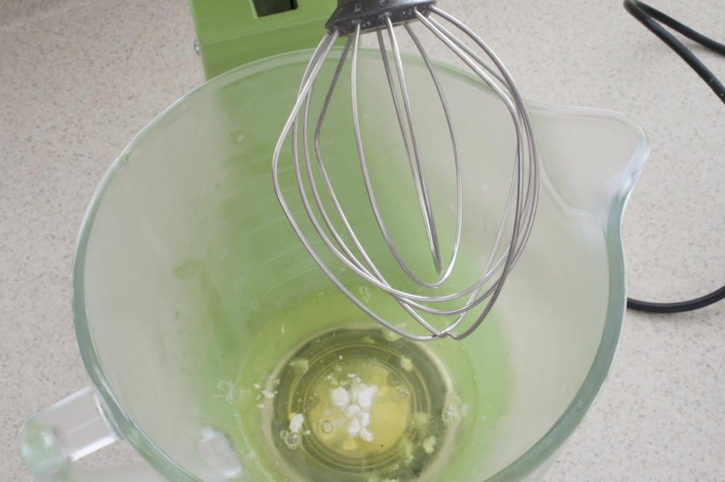 Combine egg whites and tartar in mixing bowl